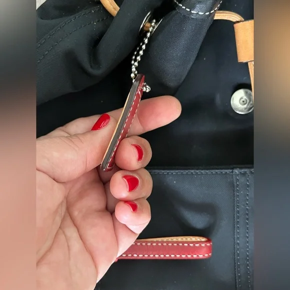 COACH canvas backpack and COACH leather wallet.